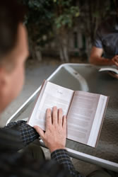 man reading the Bible