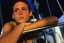 woman with folded arms over exercise equipment